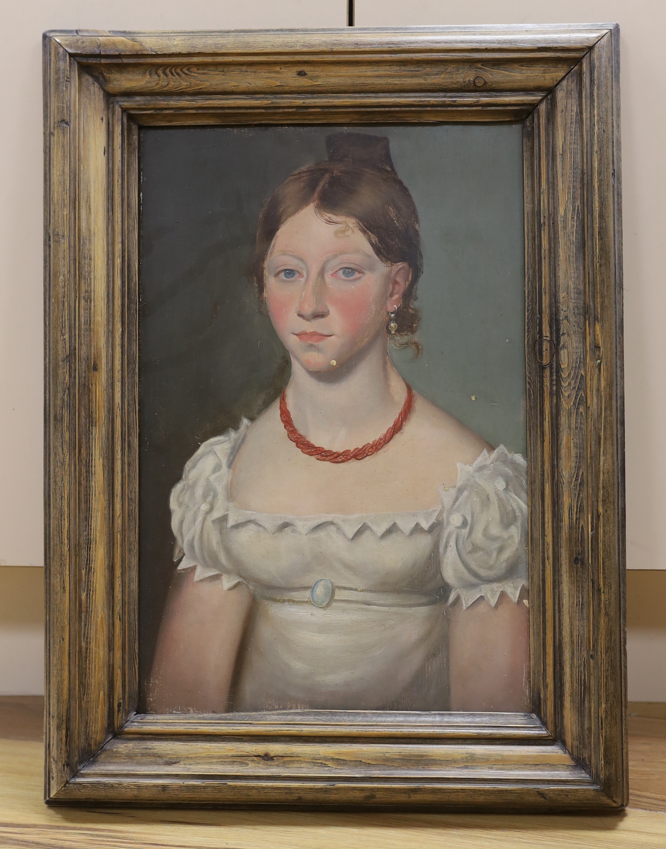 19th century Naive School, oil on board, Young lady wearing a coral necklace, 41cm x 28cm